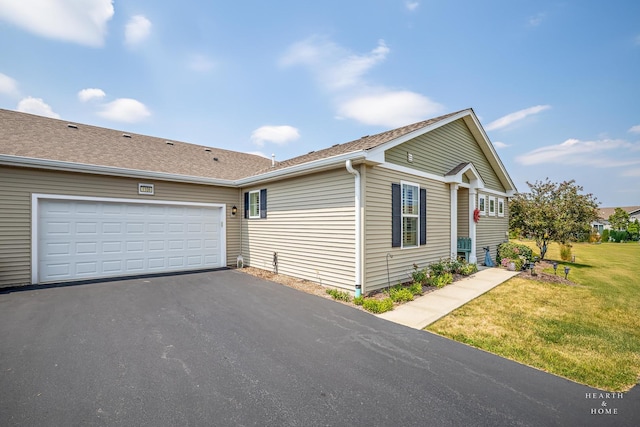 1106 Crestview Ln, Pingree Grove, IL 60140 - view of home's exterior featuring asphalt driveway, a lawn, and a garage