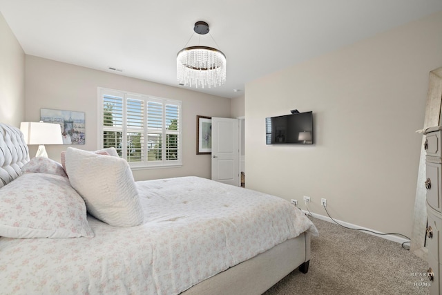 1106 Crestview Ln, Pingree Grove, IL 60140 - carpeted bedroom with a chandelier and baseboards