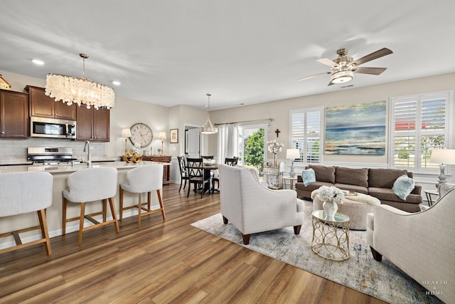 1106 Crestview Ln, Pingree Grove, IL 60140 - living room with light wood-style flooring, ceiling fan, recessed lighting, and a chandelier
