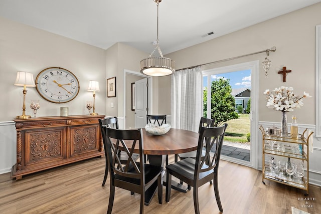 1106 Crestview Ln, Pingree Grove, IL 60140 - dining area featuring light wood-style floors and wainscoting
