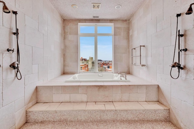 545 W Aldine Ave Unit 6E, Chicago, IL 60657 - bathroom with a bath and tile walls