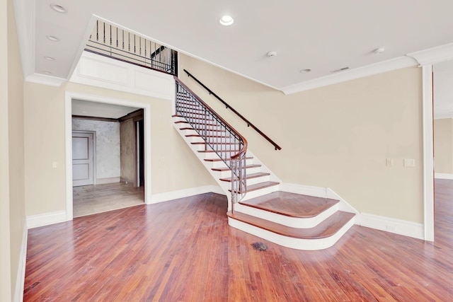 545 W Aldine Ave Unit 6E, Chicago, IL 60657 - stairs featuring wood finished floors, crown molding, and recessed lighting