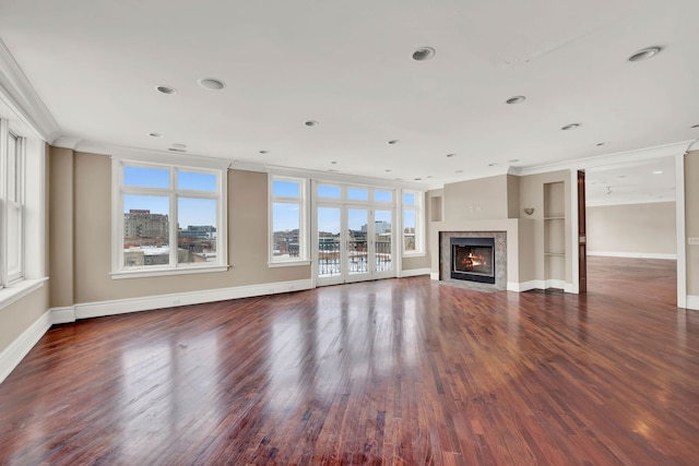 545 W Aldine Ave Unit 6E, Chicago, IL 60657 - unfurnished living room with crown molding, healthy amount of natural light, wood finished floors, a fireplace, and recessed lighting