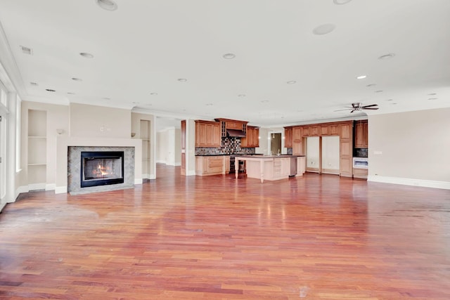 545 W Aldine Ave Unit 6E, Chicago, IL 60657 - unfurnished living room featuring ornamental molding, light wood-style floors, a premium fireplace, recessed lighting, and ceiling fan