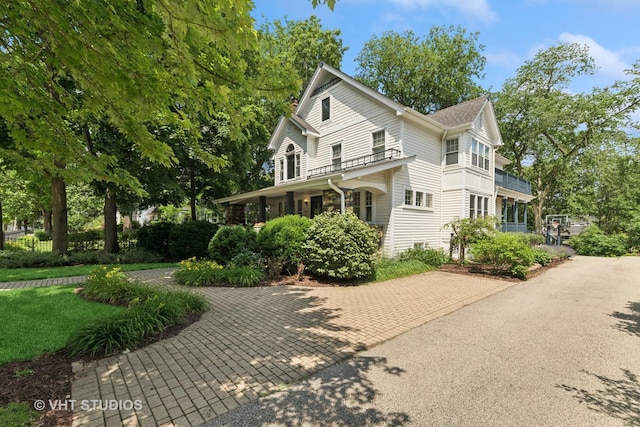 571 N Main St, Glen Ellyn, IL 60137 - view of front of property featuring a balcony and covered porch