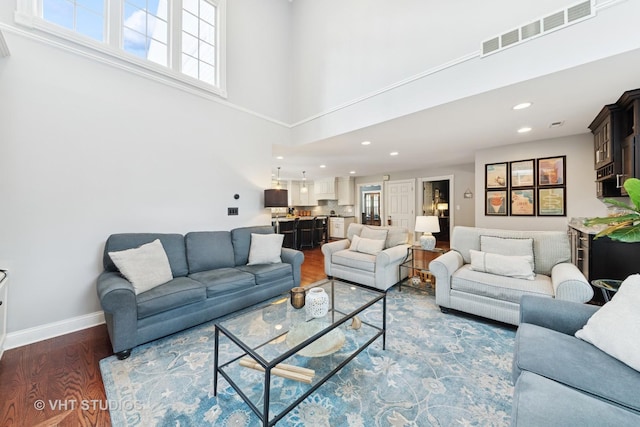 571 N Main St, Glen Ellyn, IL 60137 - living room featuring a towering ceiling, wood finished floors, and recessed lighting