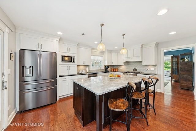 571 N Main St, Glen Ellyn, IL 60137 - kitchen with stainless steel appliances, plenty of natural light, white cabinets, and recessed lighting