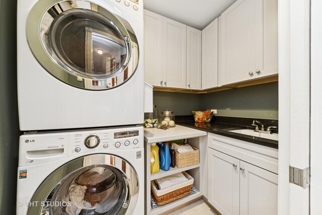 571 N Main St, Glen Ellyn, IL 60137 - washroom featuring stacked washer / drying machine and cabinet space
