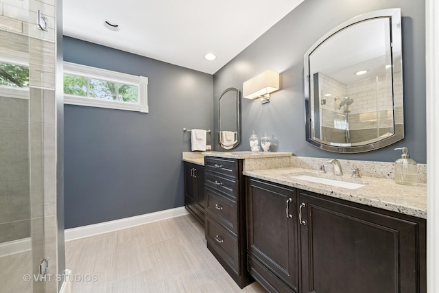571 N Main St, Glen Ellyn, IL 60137 - bathroom featuring vanity, a tile shower, and recessed lighting