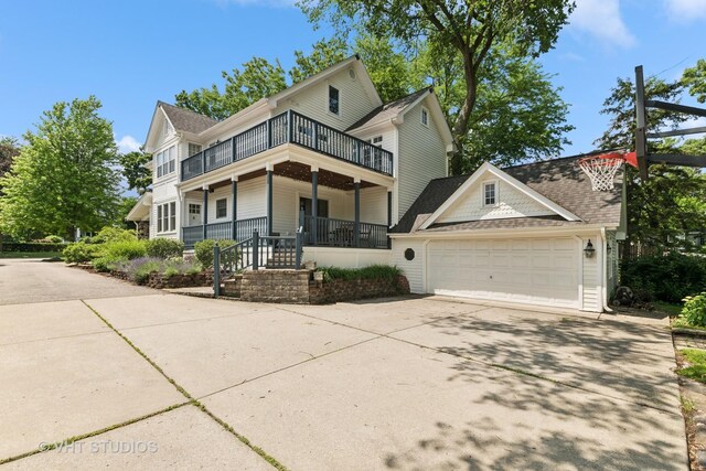 571 N Main St, Glen Ellyn, IL 60137 - view of front of property featuring a porch, a balcony, concrete driveway, a garage, and roof with shingles