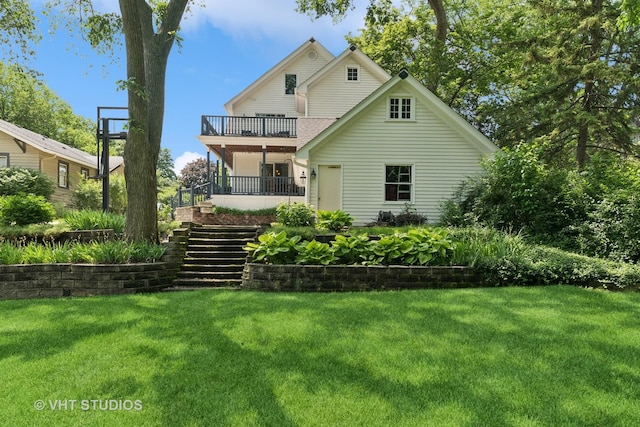 571 N Main St, Glen Ellyn, IL 60137 - back of property featuring a lawn, a balcony, and stairs
