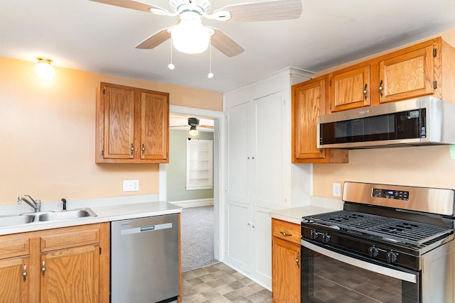 432 E Elm St, Sycamore, IL 60178 - kitchen with stainless steel appliances, ceiling fan, light countertops, light floors, and brown cabinets