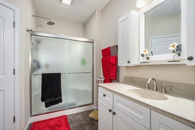 3872 Stadium St, Portage, IN 46368 - bathroom with a shower stall, vanity, and tile patterned flooring