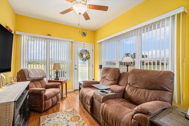 3872 Stadium St, Portage, IN 46368 - living room featuring a ceiling fan, wood finished floors, and plenty of natural light
