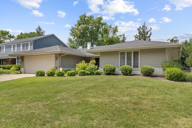 912 Eden Dr, Schaumburg, IL 60195 - view of front of home with an attached garage, a front lawn, and driveway