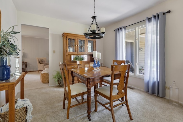 912 Eden Dr, Schaumburg, IL 60195 - dining area with a chandelier and light carpet