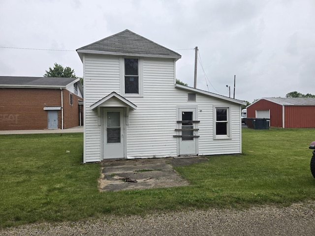 101 Vine St, Ludlow, IL 60949 - rear view of house featuring a yard and roof with shingles