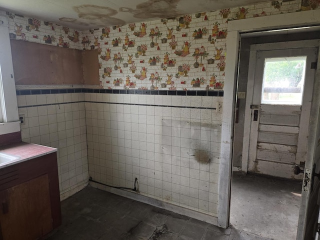 101 Vine St, Ludlow, IL 60949 - bathroom featuring a wainscoted wall, tile walls, and vanity