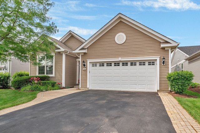 739 Pleasant Dr, Shorewood, IL 60404 - ranch-style home with driveway and an attached garage