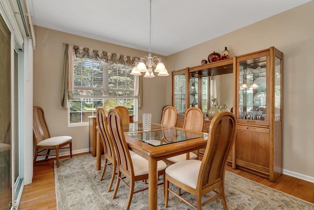 739 Pleasant Dr, Shorewood, IL 60404 - dining space featuring a chandelier and light wood-style floors