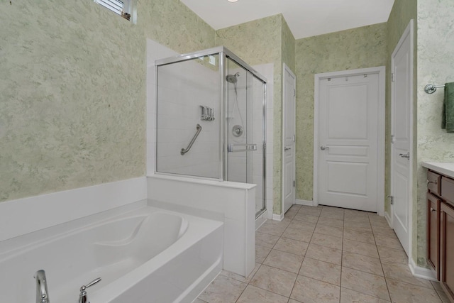 739 Pleasant Dr, Shorewood, IL 60404 - bathroom with vanity, a shower stall, a garden tub, wallpapered walls, and tile patterned floors