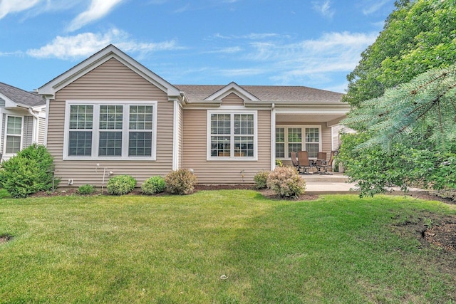 739 Pleasant Dr, Shorewood, IL 60404 - rear view of house with a patio and a lawn