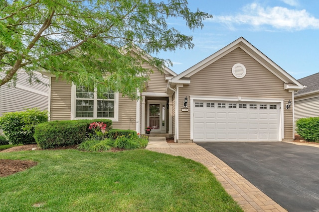 739 Pleasant Dr, Shorewood, IL 60404 - view of front facade with asphalt driveway, a garage, and a front yard