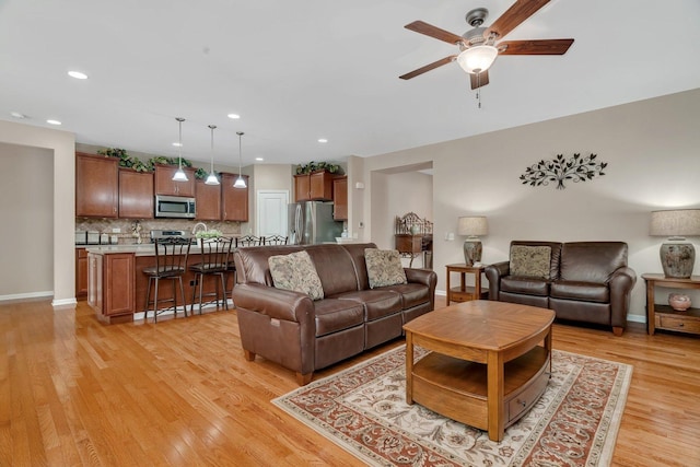 739 Pleasant Dr, Shorewood, IL 60404 - living area featuring ceiling fan, light wood-style floors, and recessed lighting
