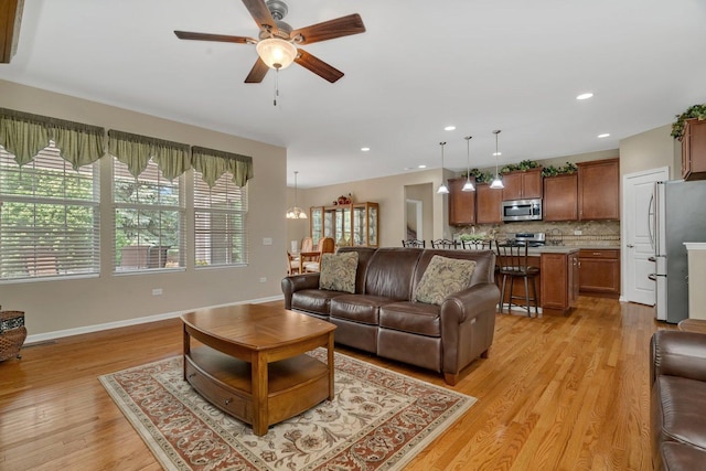 739 Pleasant Dr, Shorewood, IL 60404 - living area featuring ceiling fan, light wood-style floors, and recessed lighting