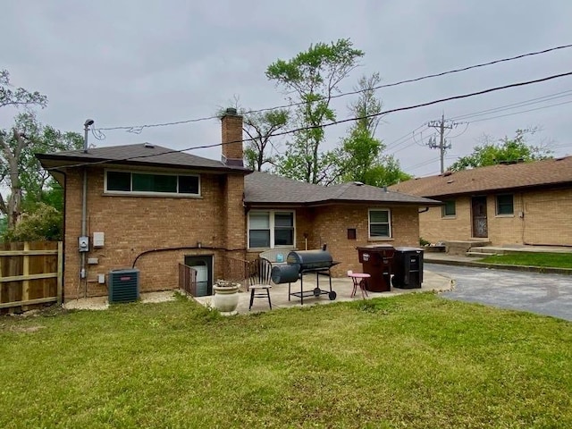 2803 172nd St, Hazel Crest, IL 60429 - back of house with brick siding, a chimney, and a patio