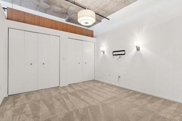 6 S Laflin St Unit 607, Chicago, IL 60607 - unfurnished bedroom featuring two closets and carpet