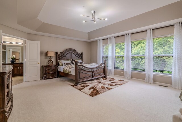 105 Black Hill Dr, Streamwood, IL 60107 - bedroom with light carpet, a chandelier, and a tray ceiling