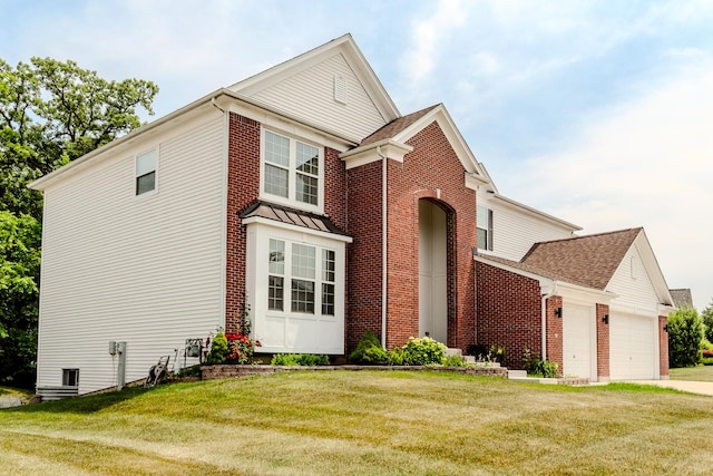 105 Black Hill Dr, Streamwood, IL 60107 - traditional-style home with brick siding, a front lawn, a garage, and a shingled roof