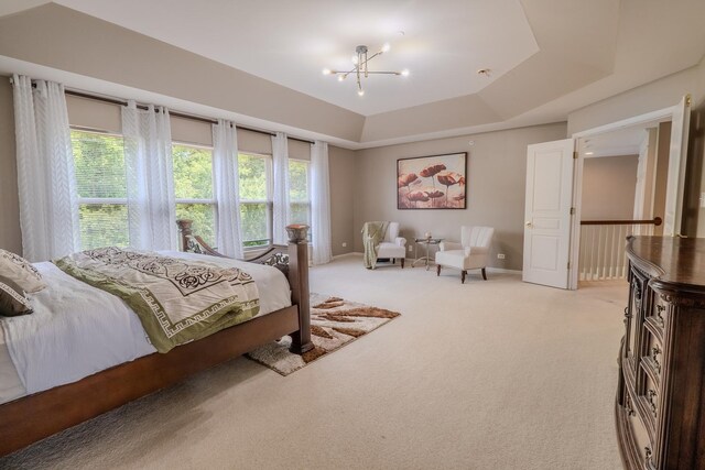 105 Black Hill Dr, Streamwood, IL 60107 - bedroom featuring light carpet, a chandelier, and a raised ceiling