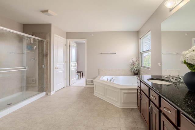 105 Black Hill Dr, Streamwood, IL 60107 - full bathroom featuring vanity, a garden tub, tile patterned flooring, and a stall shower