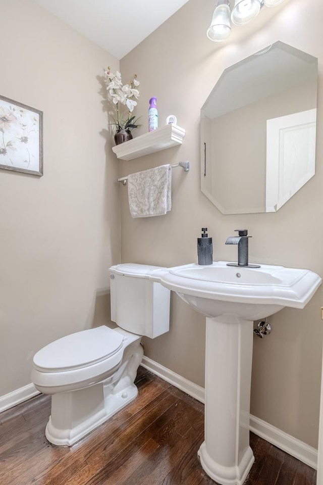 105 Black Hill Dr, Streamwood, IL 60107 - half bathroom featuring toilet and wood finished floors