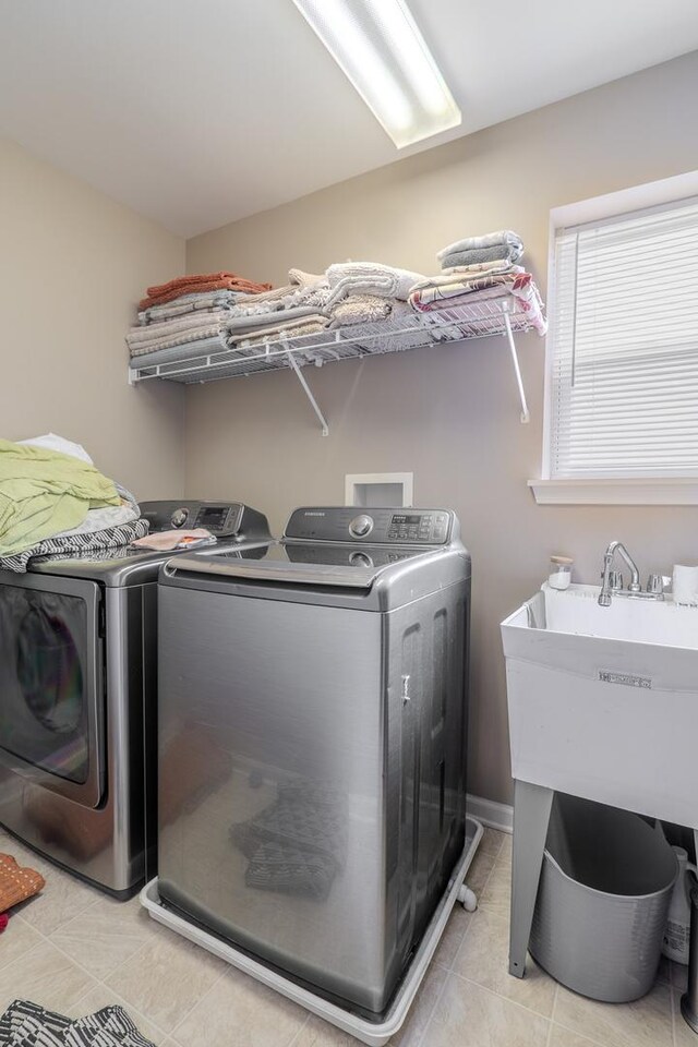 105 Black Hill Dr, Streamwood, IL 60107 - laundry room featuring washer and clothes dryer and light tile patterned flooring