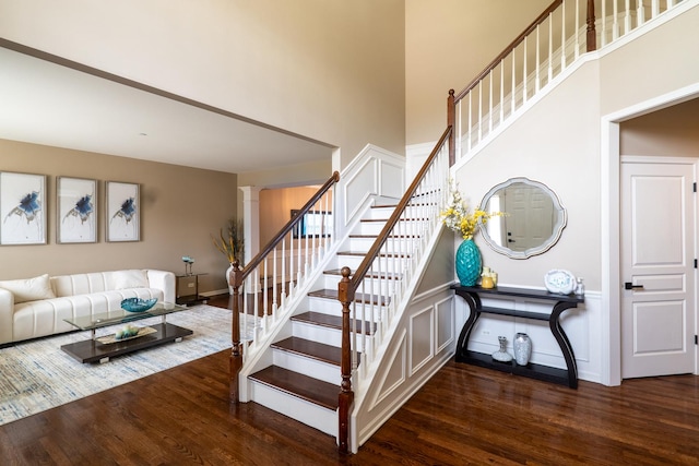 105 Black Hill Dr, Streamwood, IL 60107 - stairway with wood finished floors, a towering ceiling, and ornate columns