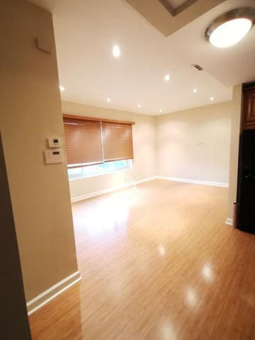 2121 N Saint Louis Ave Unit 3S, Chicago, IL 60647 - spare room featuring light wood-style flooring and recessed lighting