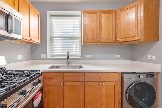 4752 N Albany Ave Unit 3, Chicago, IL 60625 - kitchen with washer / clothes dryer, stainless steel appliances, and light countertops