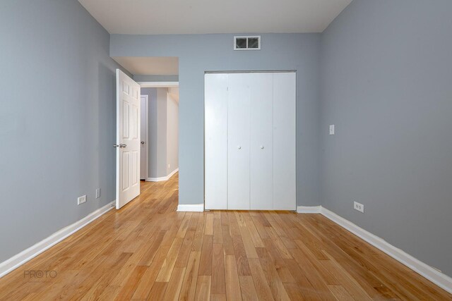 4752 N Albany Ave Unit 3, Chicago, IL 60625 - unfurnished bedroom featuring light wood-type flooring and a closet