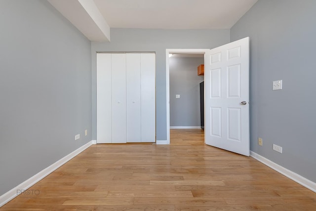 4752 N Albany Ave Unit 3, Chicago, IL 60625 - unfurnished bedroom with light wood-type flooring and a closet