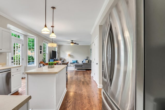 1312 Dorchester Dr, Mundelein, IL 60060 - kitchen featuring stainless steel appliances, white cabinets, light countertops, wood finished floors, and ceiling fan