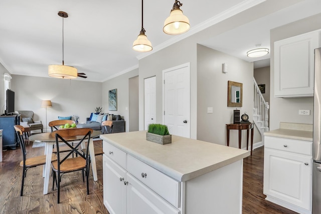 1312 Dorchester Dr, Mundelein, IL 60060 - kitchen featuring ornamental molding, dark wood-type flooring, open floor plan, and white cabinetry