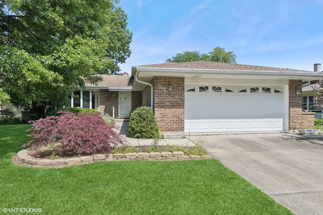7769 Danbury Dr, Darien, IL 60561 - ranch-style house with brick siding, an attached garage, driveway, and a front yard