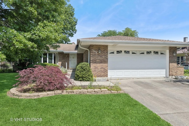 7769 Danbury Dr, Darien, IL 60561 - single story home with brick siding, a garage, driveway, a front lawn, and roof with shingles