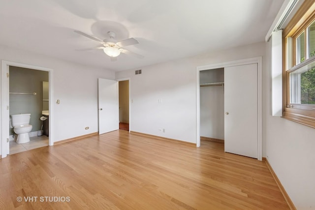 7769 Danbury Dr, Darien, IL 60561 - unfurnished bedroom with light wood-style flooring, a closet, connected bathroom, and ceiling fan