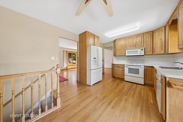 7769 Danbury Dr, Darien, IL 60561 - kitchen featuring white appliances, light wood-style floors, light countertops, and decorative backsplash