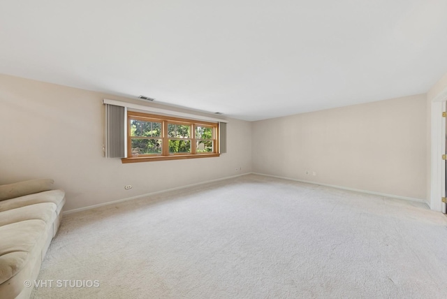 7769 Danbury Dr, Darien, IL 60561 - unfurnished living room featuring light colored carpet