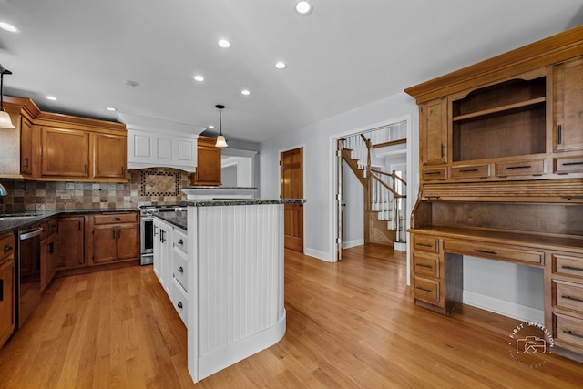 342 Dilorenzo Dr, Naperville, IL 60565 - kitchen featuring appliances with stainless steel finishes, decorative backsplash, brown cabinets, a kitchen island, and recessed lighting